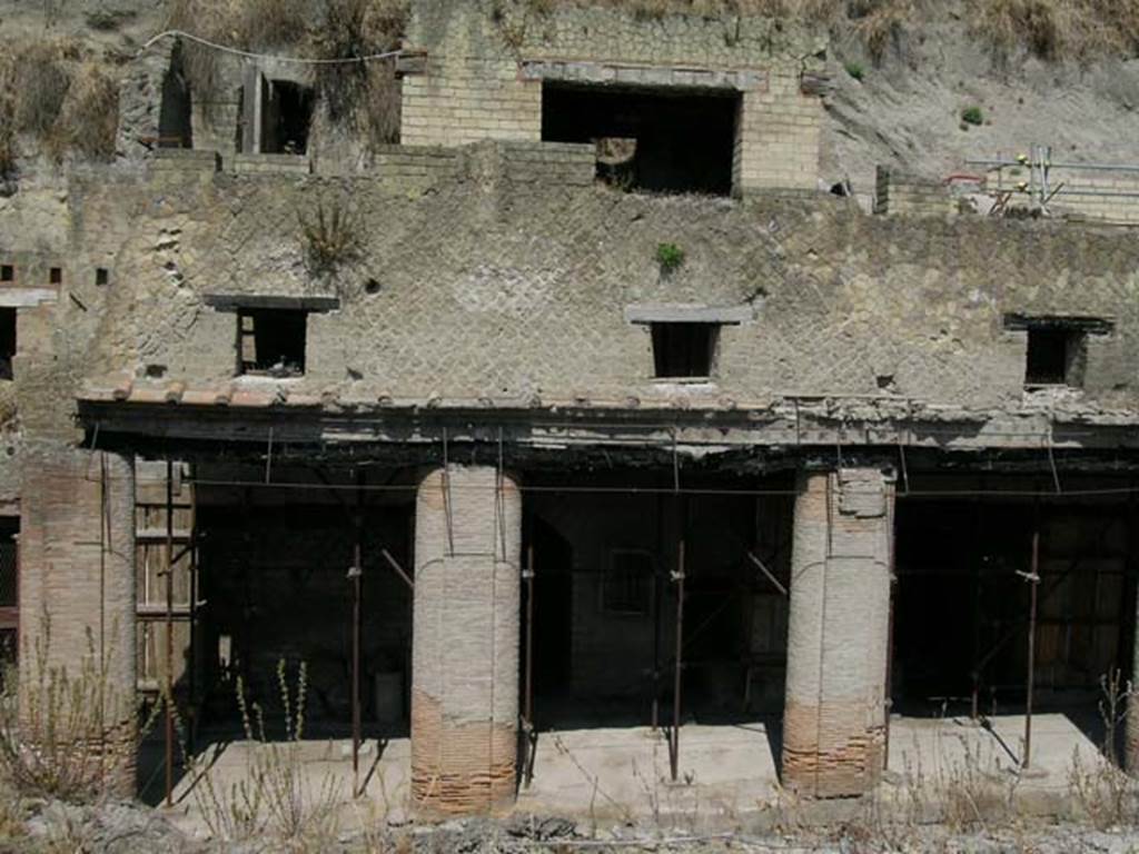 Decumanus Maximus, Herculaneum, May 2006. Looking towards lower and upper floors of no. 3, centre right.
Photo courtesy of Nicolas Monteix. 
