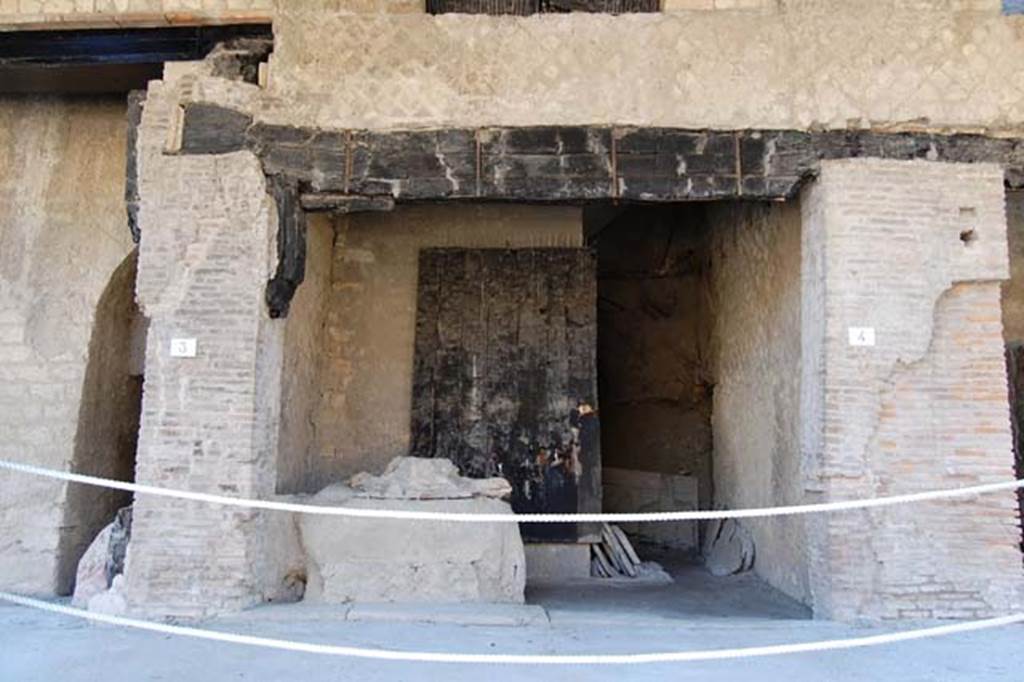 Decumanus Maximus, Herculaneum, May 2011.
Building on north side of the Decumanus Maximus, doorway to shop numbered 4
Photo courtesy of Nicolas Monteix.
