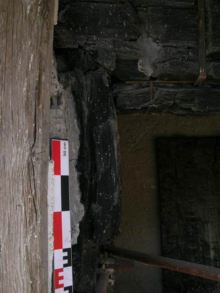 Decumanus Maximus, Herculaneum. May 2006. Carbonised wood from west side of doorway numbered 4.
Photo courtesy of Nicolas Monteix.
