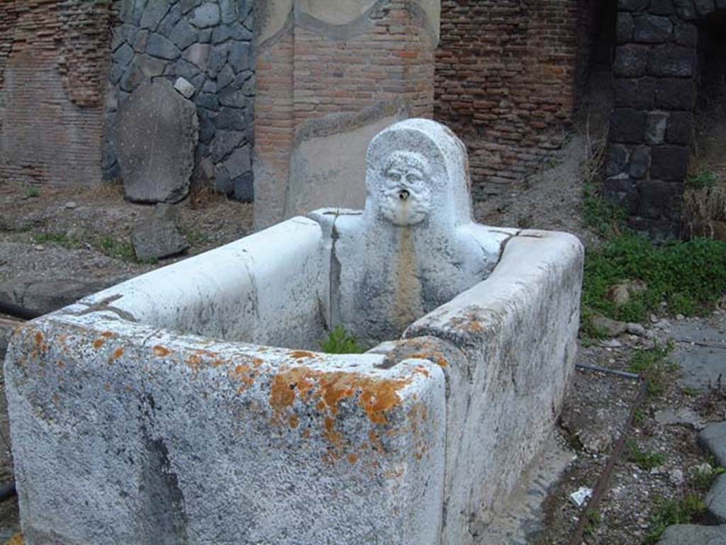 Decumanus Maximus, Herculaneum, May 2001.  Fountain decorated with head of Hercules, from fountain on east end of the Decumanus Maximus.  Photo courtesy of Current Archaeology.

