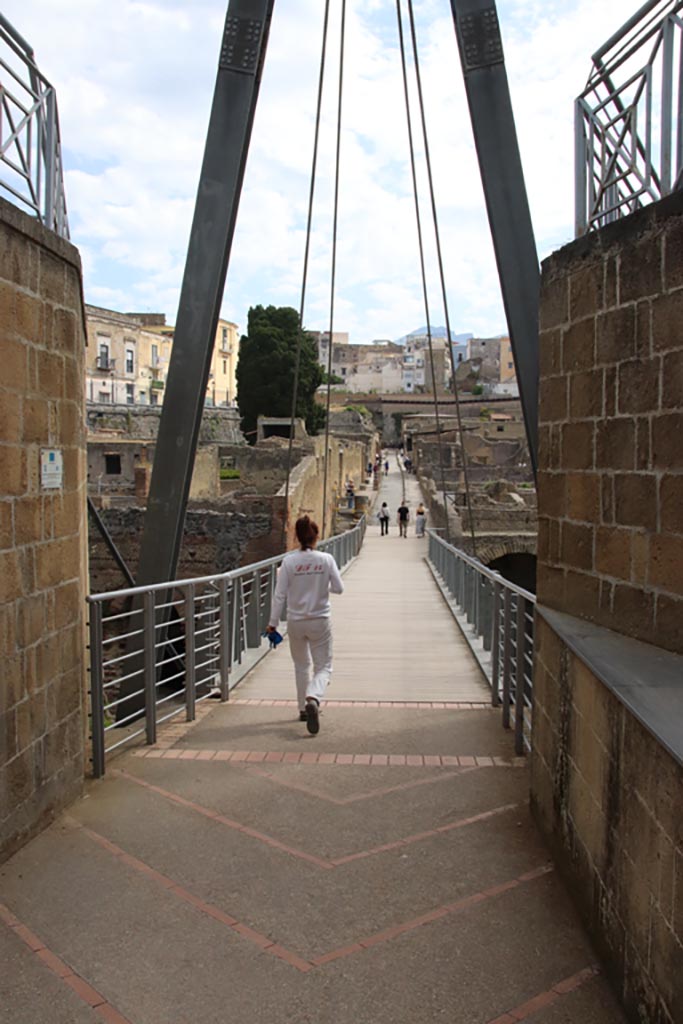 Herculaneum, May 2024.  
Looking north across access bridge towards roadway known as Cardo III Inferiore. 
Photo courtesy of Klaus Heese. 
