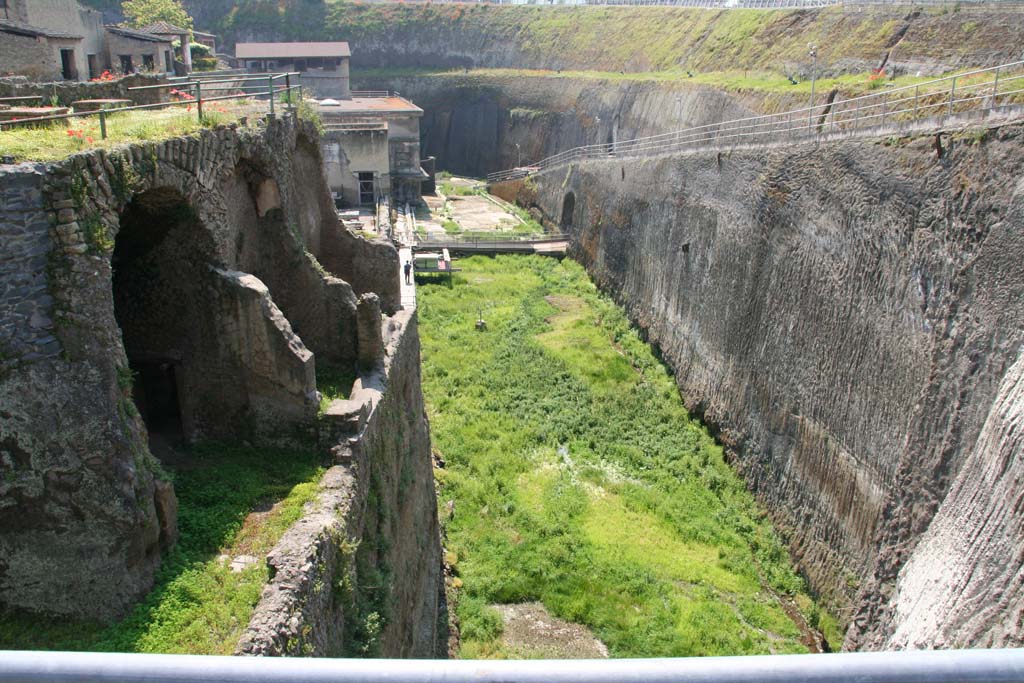 Herculaneum, April 2011.  
Looking east from access bridge towards lower rooms of Casa dell’Albergo, (III.1/2/18/19) and area of the beachfront.
Photo courtesy of Klaus Heese.
