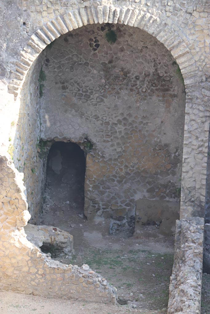 III.1/2/18/19, Herculaneum, October 2023. 
Looking towards north wall of room G, with doorway into a corridor leading to a doorway onto Cardo III (blocked).  
Photo courtesy of Klaus Heese.
