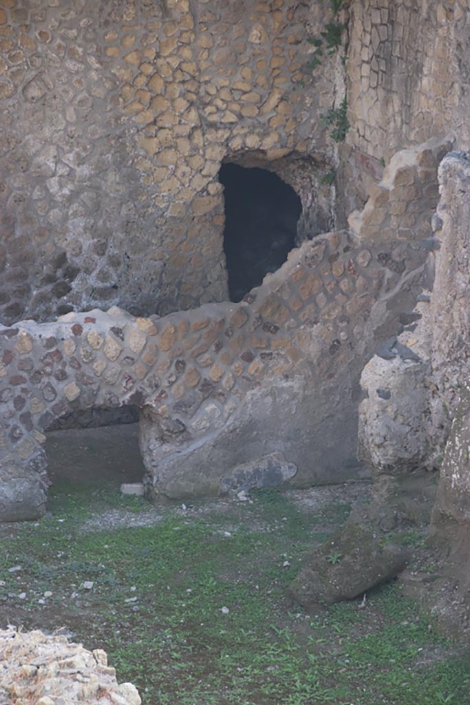 III.1/2/18/19, Herculaneum, October 2023. 
Room F, looking towards north wall and corridor at rear. Photo courtesy of Klaus Heese.
