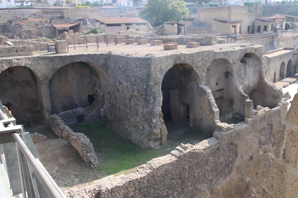 III.1/2/18/19, Herculaneum, October 2023. Looking north-east from access bridge towards lower rooms. Photo courtesy of Klaus Heese.