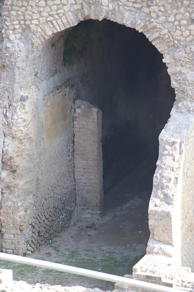 III.1/2/18/19, Herculaneum. October 2023. 
Room E, west wall with remains of painted yellow decoration. Photo courtesy of Klaus Heese.
