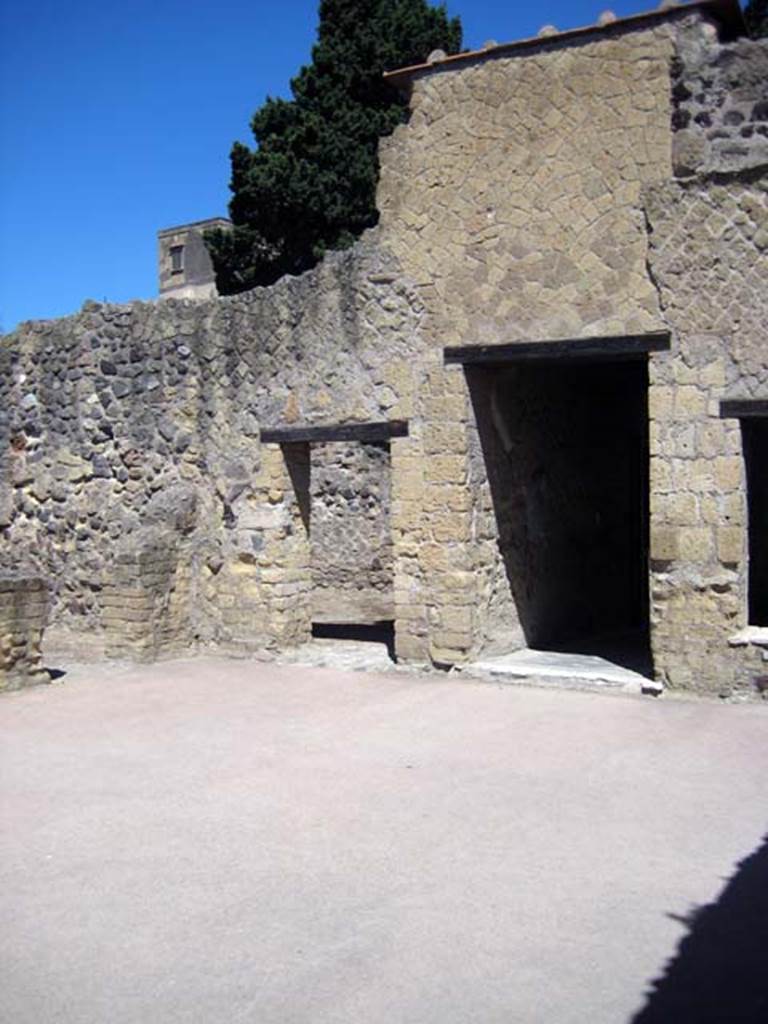 III.3 Herculaneum. June 2011. Looking towards south-west corner of atrium.
Doorway to a cubiculum, on left, doorway to a living room, centre left, and doorway leading to entrance corridor, on right. Photo courtesy of Sera Baker.
