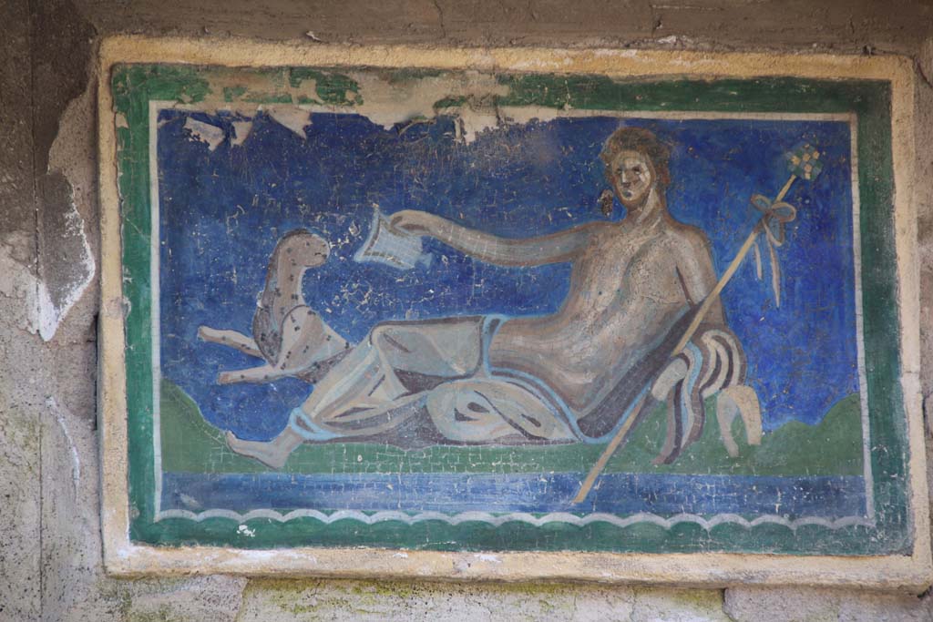 III.3 Herculaneum, April 2014. Central of the three reproduction modern mosaics of the frieze.
Photo courtesy of Klaus Heese. 
According to Guidobaldi and Esposito, this shows a reclining Dionysus with his panther which was flanked by the pair of tritons.
Original now in Naples Archaeological Museum, inventory number 9989.
