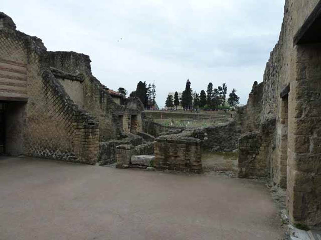 III.3 Herculaneum. May 2010. Looking across atrium towards rooms on the south side. The doorway with the white stone would have contained the steps to the upper floor.
