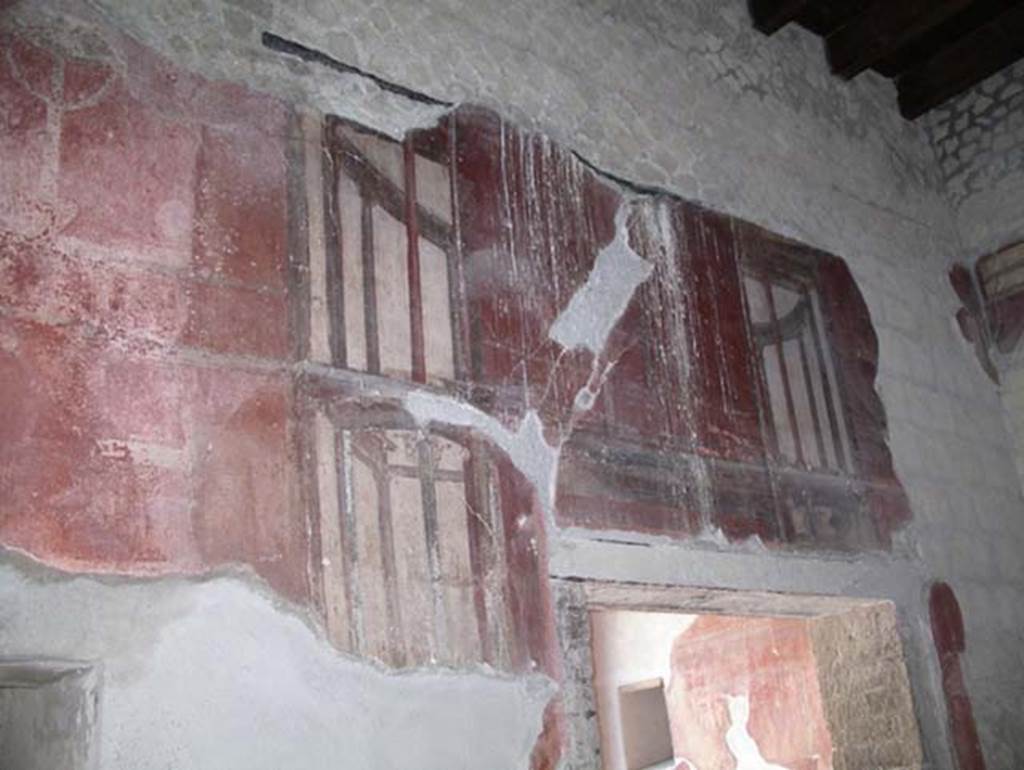 III.3 Herculaneum, April 2005. West wall of triclinium, detail from above doorway to tablinum.  Photo courtesy of Michael Binns.
