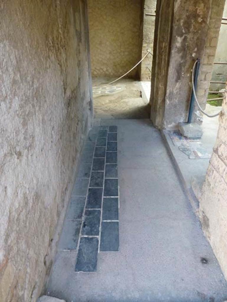 III.3 Herculaneum, October 2012.  Looking east along corridor leading to triclinium, and small light-yard, on right. Photo courtesy of Michael Binns.
