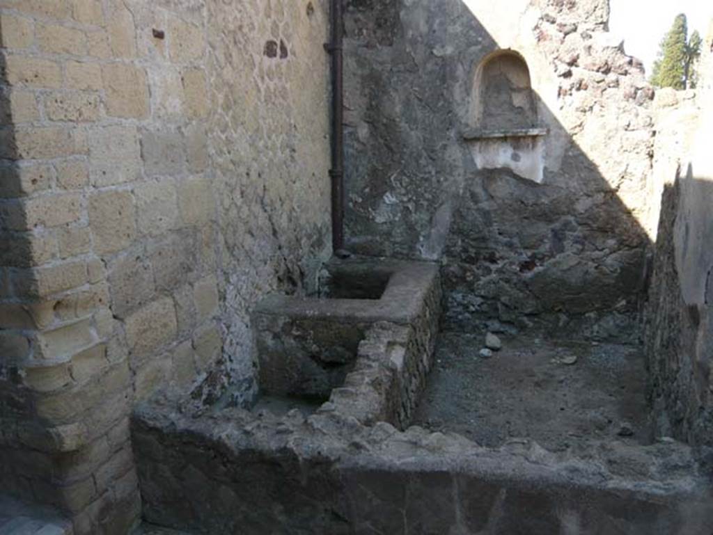 III.3 Herculaneum. August 2013. Looking towards south wall with niche in area with vats/basins on south side of room 20. 
Photo courtesy of Buzz Ferebee.
