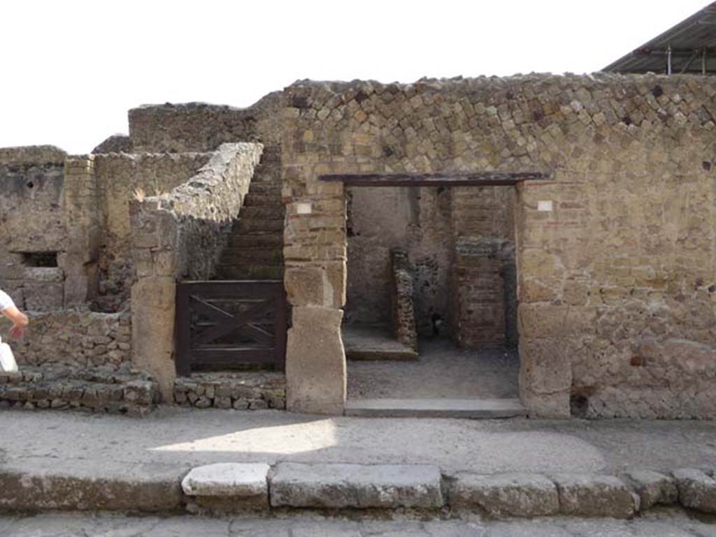 III.4 Herculaneum, on right. October 2014. Looking east to doorways. III.5 leads to the stairs, on the left.  Photo courtesy of Michael Binns.
