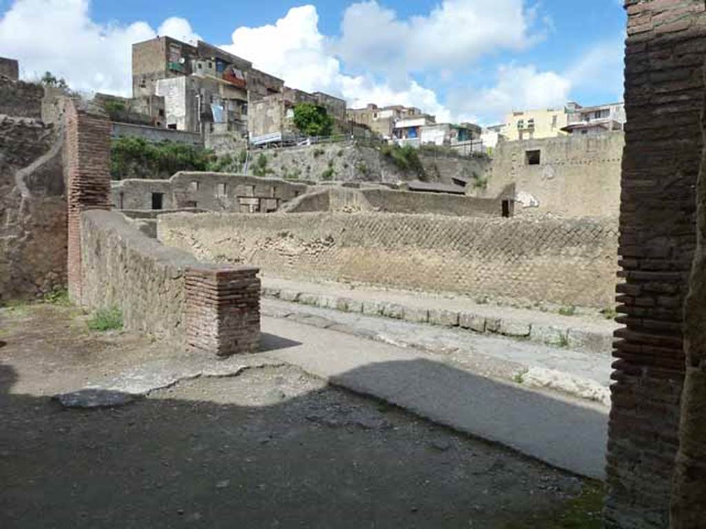 Ins. III.8, Herculaneum. May 2010. Looking north-west out of entrance doorway of shop, on the north side of Ins. III onto Decumanus Inferior. 
