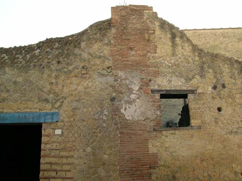 III.10, Herculaneum. May 2005. Upper wall to west side of entrance doorway in northern facade of Insula III. 
Window of III.9. Photo courtesy  of Nicolas Monteix.
