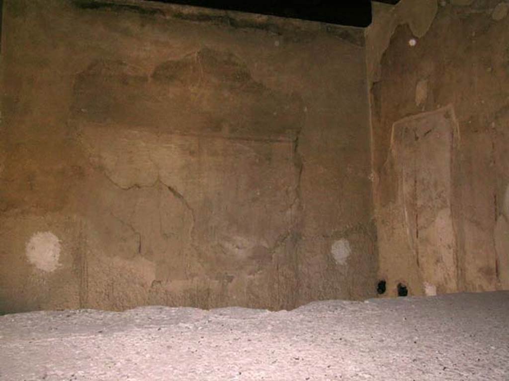 III.10, Herculaneum. May 2005. Looking towards south wall and south-west corner with remains of painted decoration. 
Photo courtesy of Nicolas Monteix.
