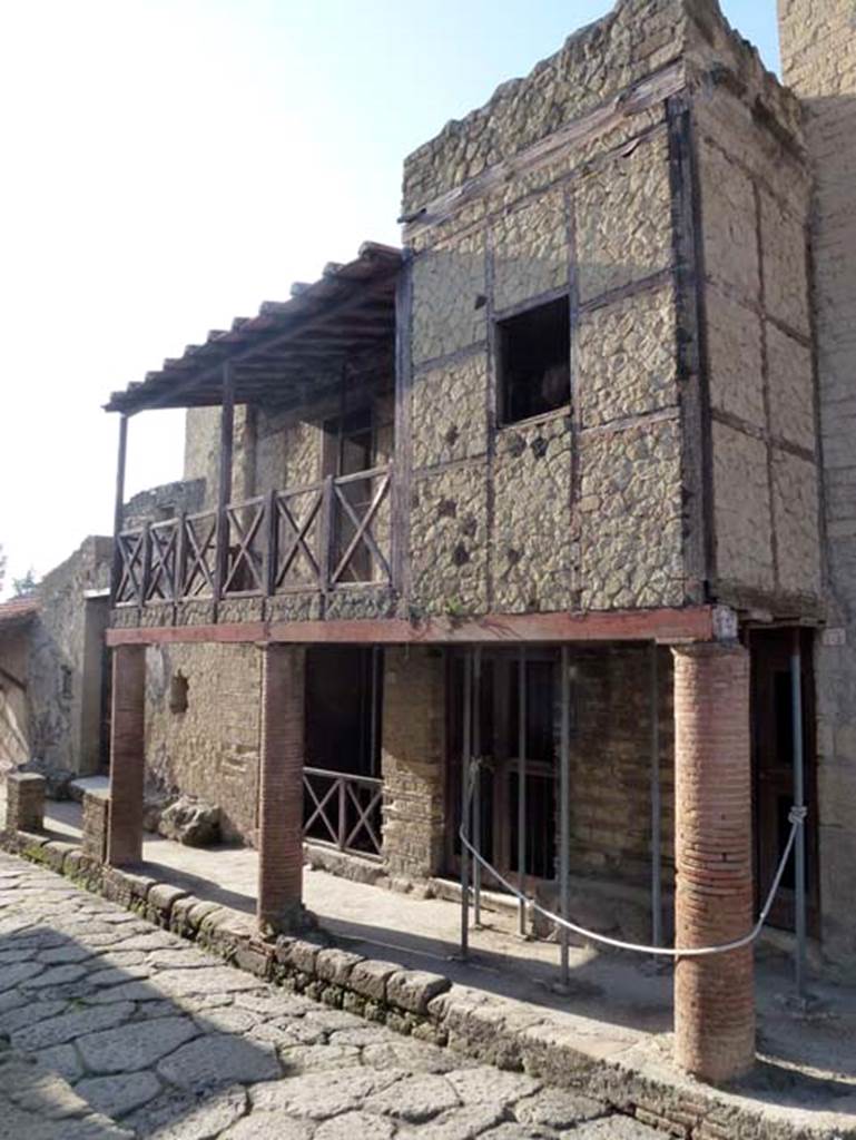 III 15, 14, and 13, Herculaneum. October 2012. Looking towards doorways under street portico formed by balcony. Photo courtesy of Michael Binns. 
