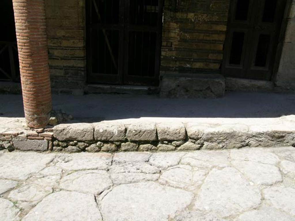 III.15/14/13, Herculaneum. April 2005. 
Looking west towards masonry column in centre of balcony, and doorways at III.14 and III.13. 
Photo courtesy of Nicolas Monteix.
