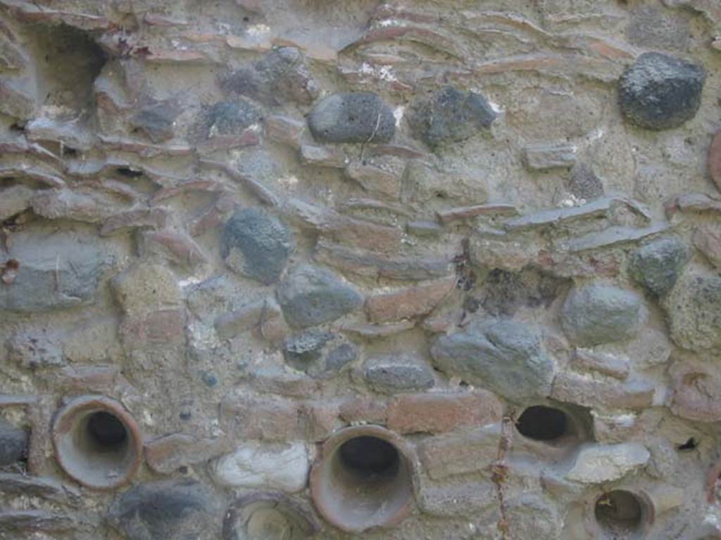 III.14/15, Herculaneum, May 2003. Room 12, detail from south wall. Photo courtesy of Nicolas Monteix.