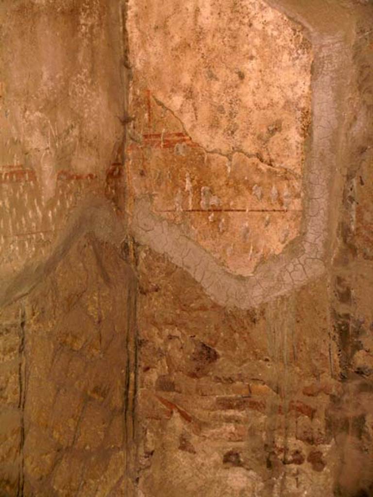 III 15, Herculaneum, April 2005. 
Painted decoration (enhanced) on south end of west wall of shop room.
Photo courtesy of Nicolas Monteix.
