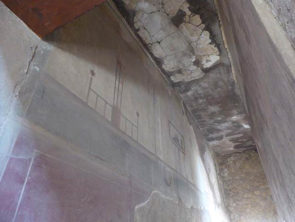 III.16, Herculaneum, October 2014. Corridor 6, looking west along upper south wall, with painting of sacred landscape in situ.
Photo courtesy of Michael Binns.

