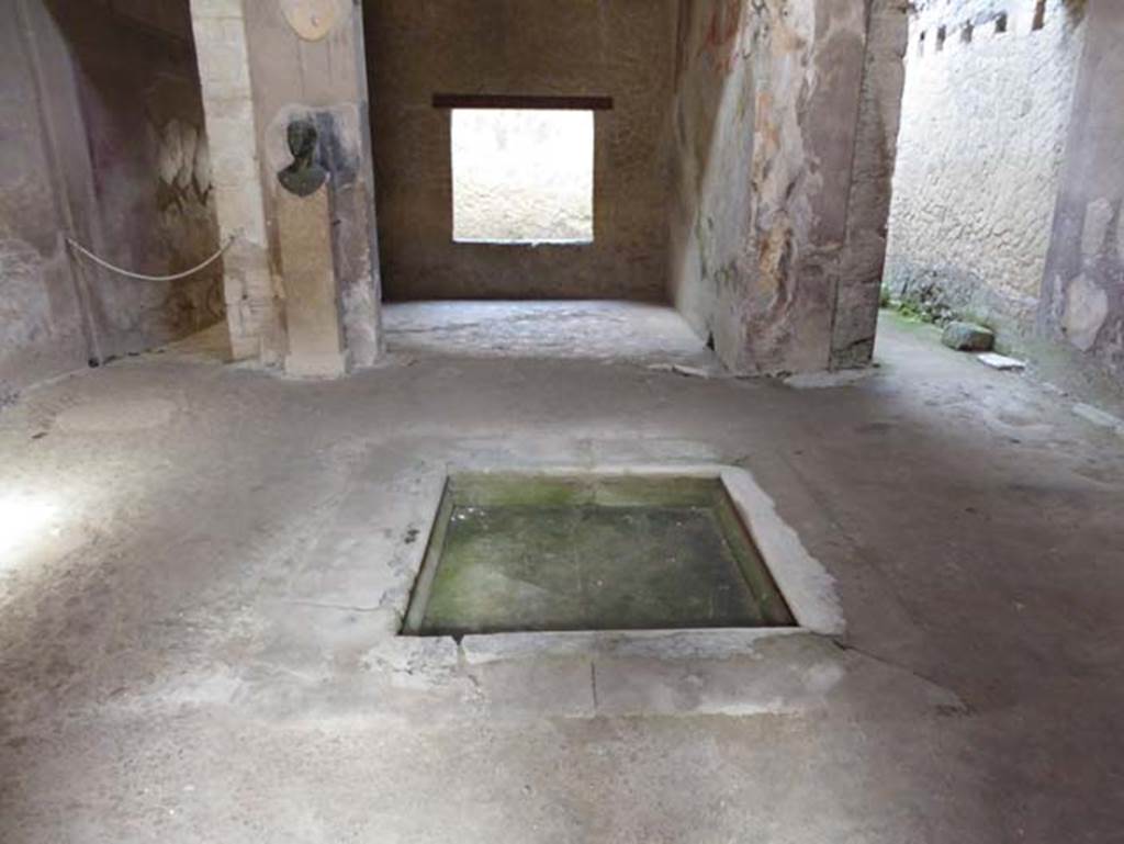 III.16, Herculaneum, October 2014. Looking west across impluvium in atrium towards tablinum, in centre.  Photo courtesy of Michael Binns.
