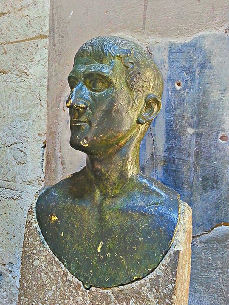 III 16, Herculaneum, photo taken between October 2014 and November 2019. 
Reproduction bronze herm on west side of atrium 9. Photo courtesy of Giuseppe Ciaramella.
