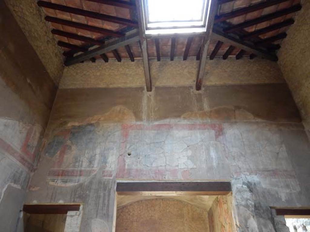 III.16, Herculaneum, May 2018. Atrium 9, looking west towards tablinum and upper compluvium. 
Photo courtesy of Buzz Ferebee

