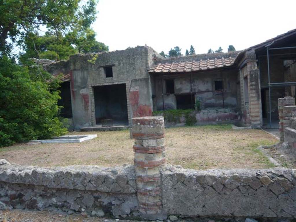 IV.2, Herculaneum, August 2013. Looking east across the garden area with a marble basin in the centre, and surrounded by a windowed portico on the north, west and south sides.  Photo courtesy of Buzz Ferebee.

