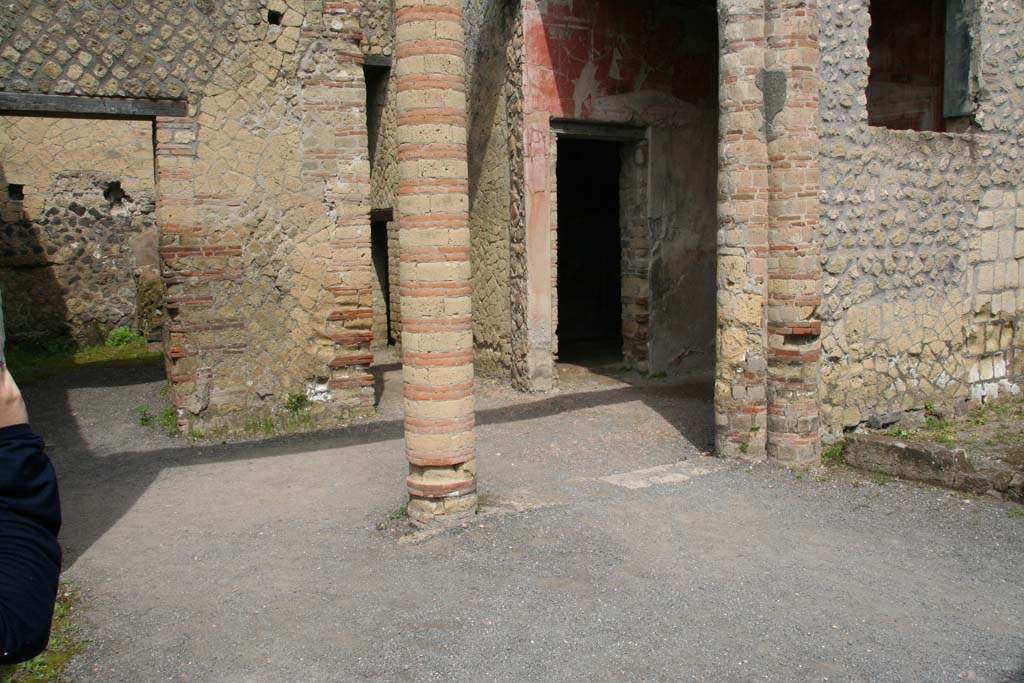 IV.4, Herculaneum, April 2013. Looking north-west from open courtyard 6, towards small courtyard 3, and towards doorway to room 4.
Photo courtesy of Klaus Heese.
