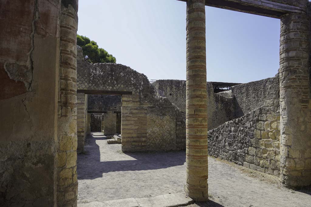 IV.4 Herculaneum, August 2021. Courtyard 3, east wall, looking south-east across open courtyard 6. Photo courtesy of Robert Hanson.