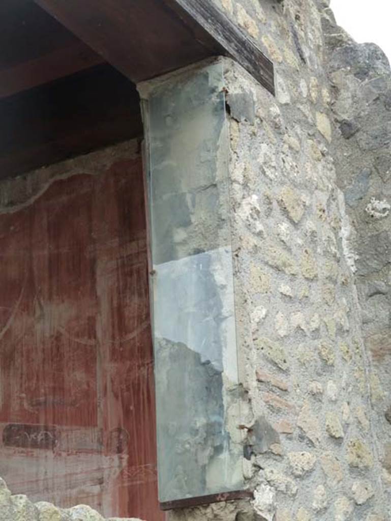 IV.4 Herculaneum. September 2015. Atrium 6, west wall with detail of window from courtyard 3. 

