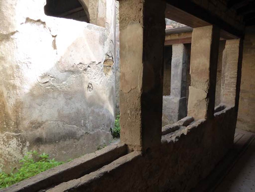 IV.4 Herculaneum. October 2014. Looking north-east from corridor 21 towards small pilastered courtyard 22. Photo courtesy of Michael Binns.
