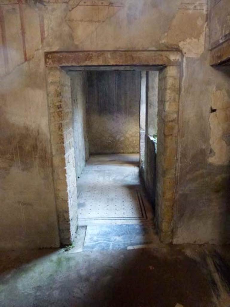 IV.4 Herculaneum. October 2012. Room 23, south wall of anteroom, with doorway to east end of corridor 21.  Photo courtesy of Michael Binns.
