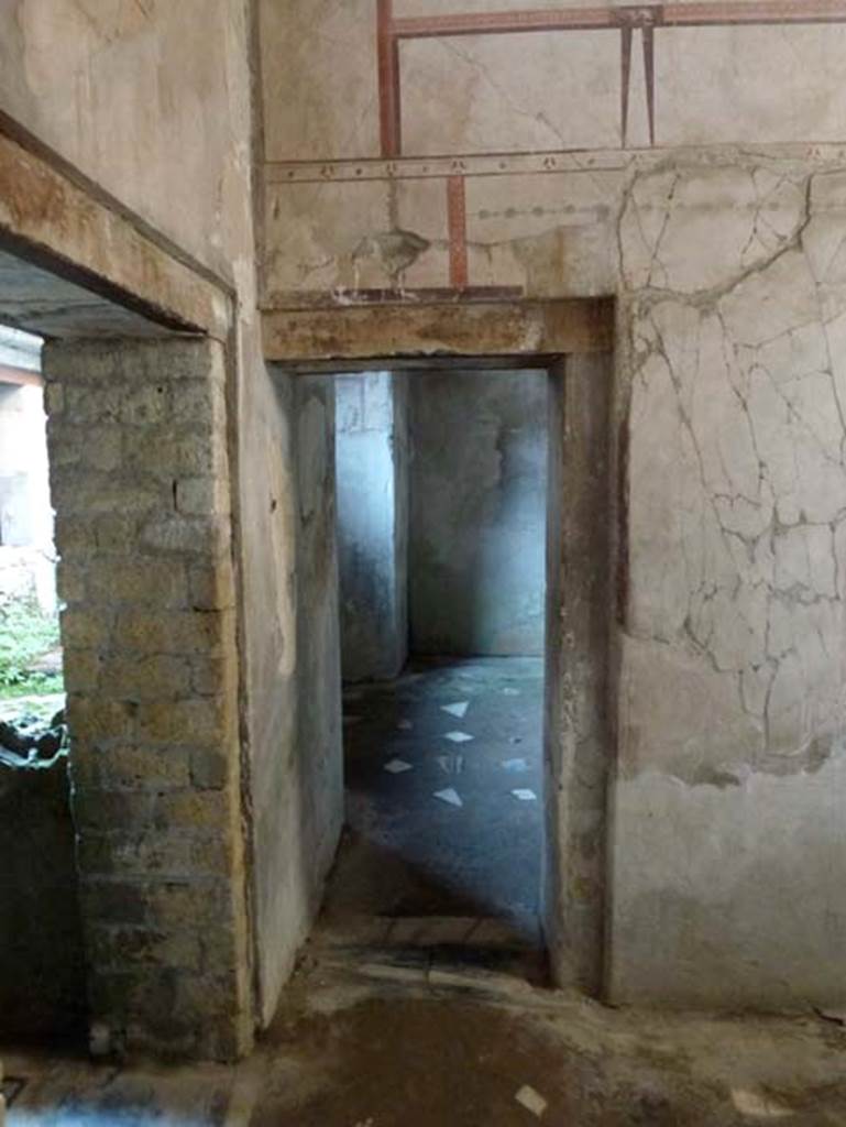 IV.4 Herculaneum. October 2012. Doorway to room 24, the room with the alcove.
Photo courtesy of Michael Binns.
