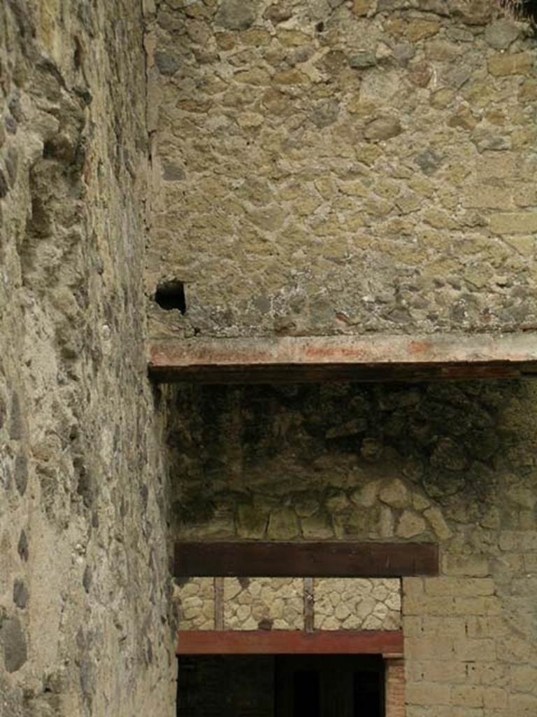 V.5, Herculaneum, May 2005. 
Looking west towards area of upper floor above entrance doorway onto Cardo IV. Inferiore. Photo courtesy of Nicolas Monteix.
