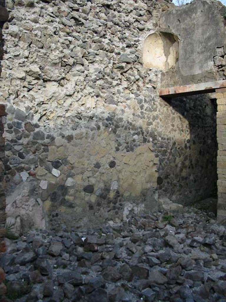 IV.6, Herculaneum, May 2003. Atrium, north-east corner, with doorway to small storeroom/cupboard. 
Photo courtesy of Nicolas Monteix.
