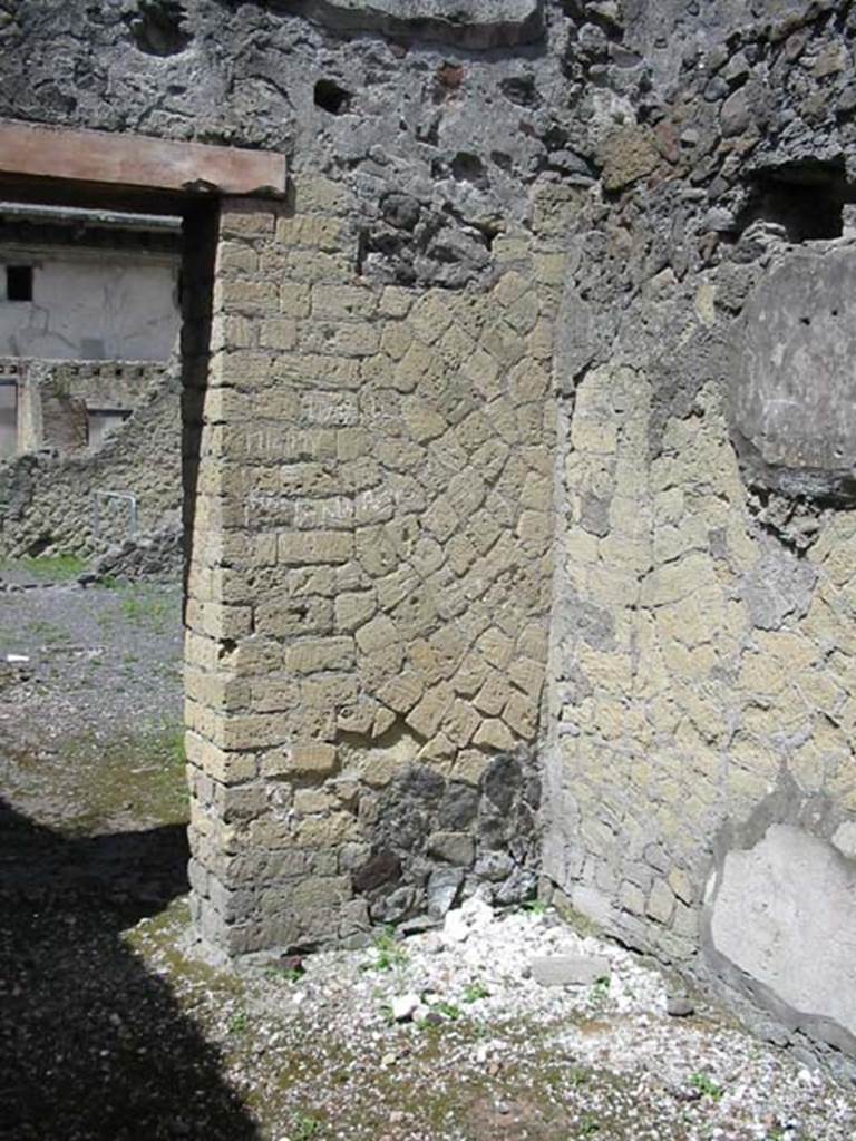 IV.6, Herculaneum, May 2003. Room 11, north west corner, looking through doorway across rear atrium.
Photo courtesy of Nicolas Monteix.
