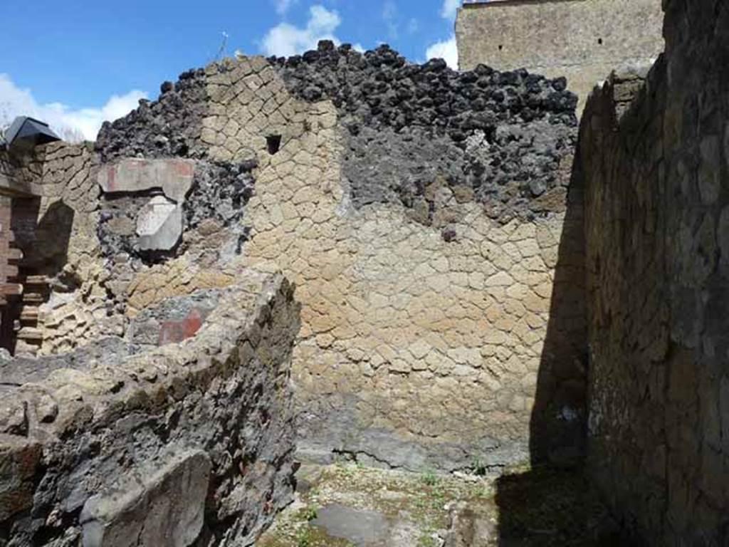 IV.8, Herculaneum, May 2010. Room 2, looking towards north wall. 
In the centre of the photo is the doorway leading to the latrine, according to Maiuri on the north wall, traces were still recognisable of a painted serpent.
