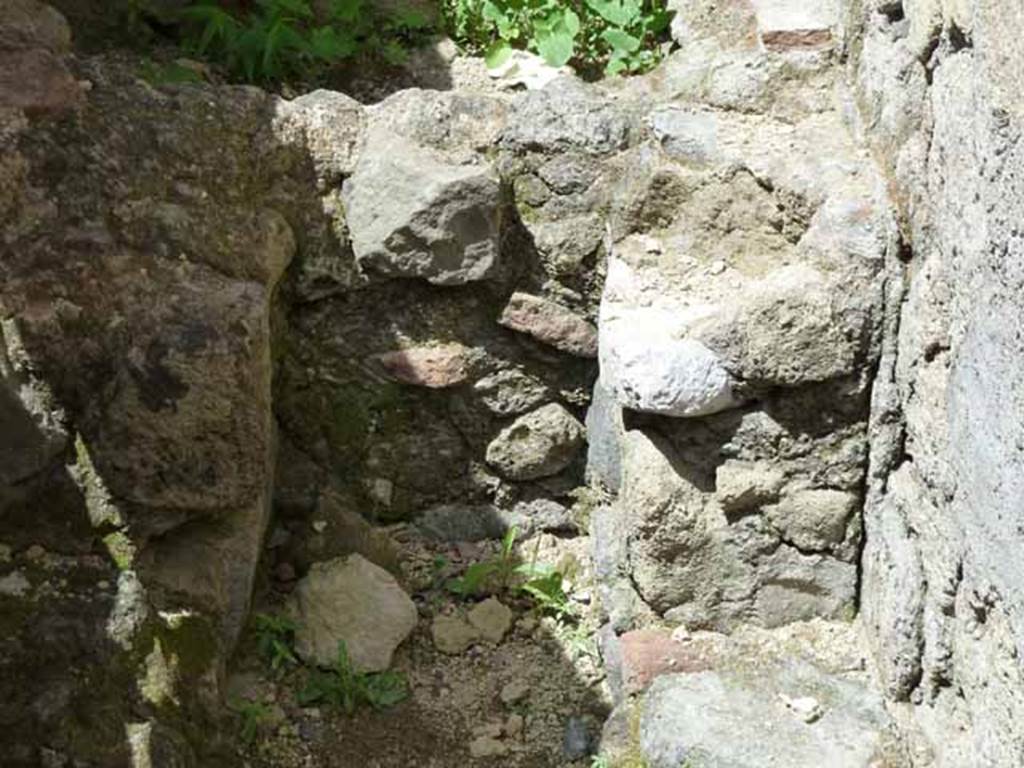 Ins. IV.8, Herculaneum, May 2010. Latrine under steps to upper floor.