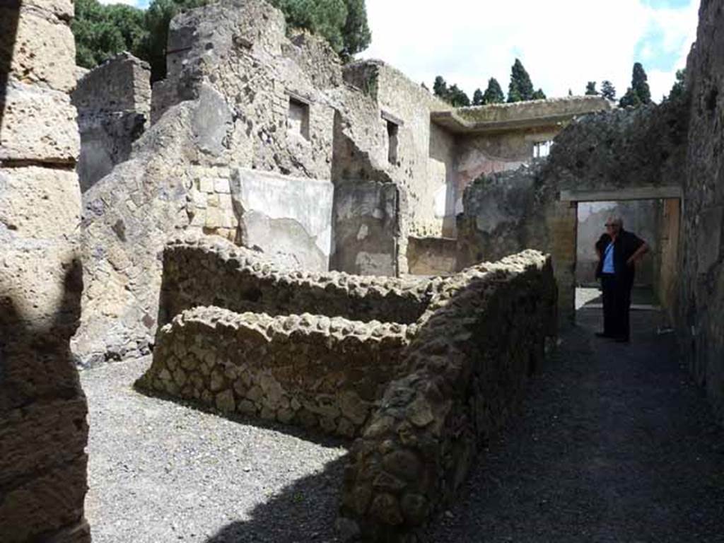 Ins. IV.8, Herculaneum, May 2010. Looking north-east across rooms. 