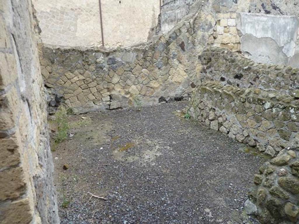 IV.8, Herculaneum, September 2015. Room 3, looking towards north wall, and with separate area or small room, on right. According to Pesando and Guidobaldi, in the north-west corner would have been the channel for the discharge pipe from the latrine above on the upper floor.
