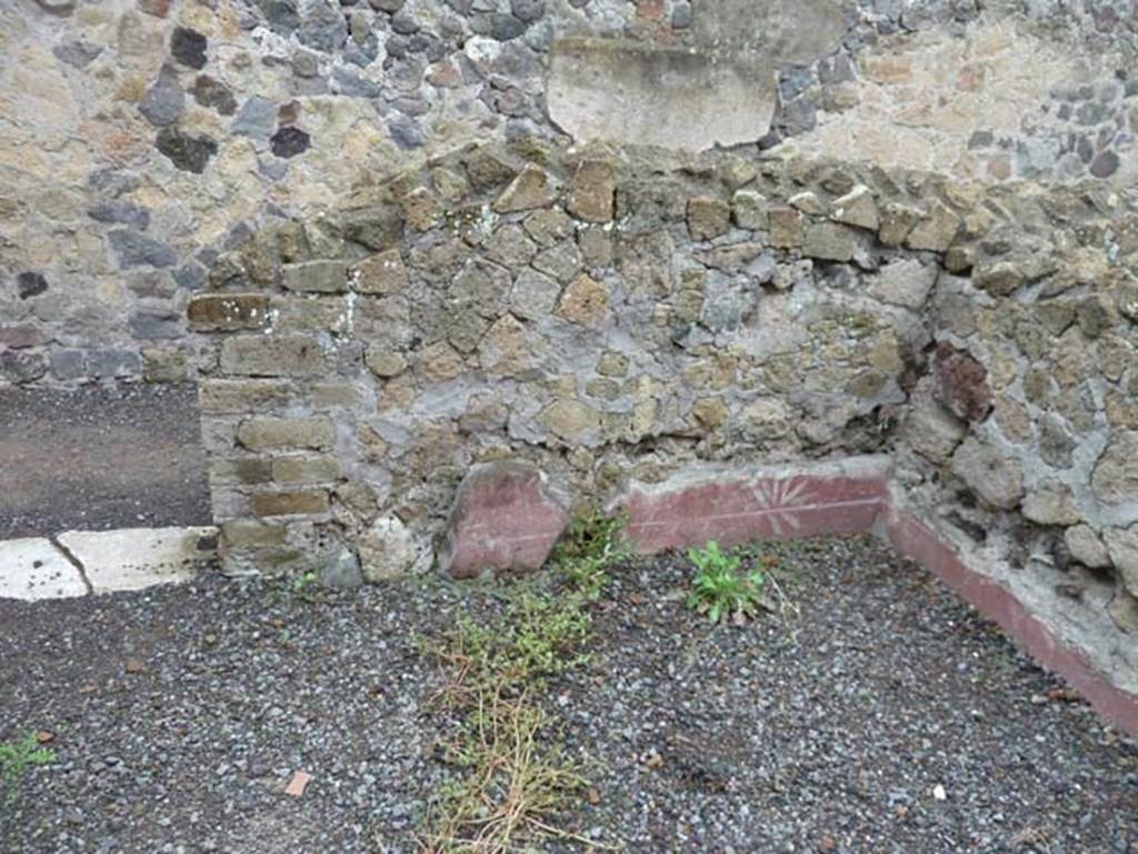 Ins. IV.8, Herculaneum, September 2015. Looking towards remains of zoccolo in south-west corner of second room on north side of corridor.