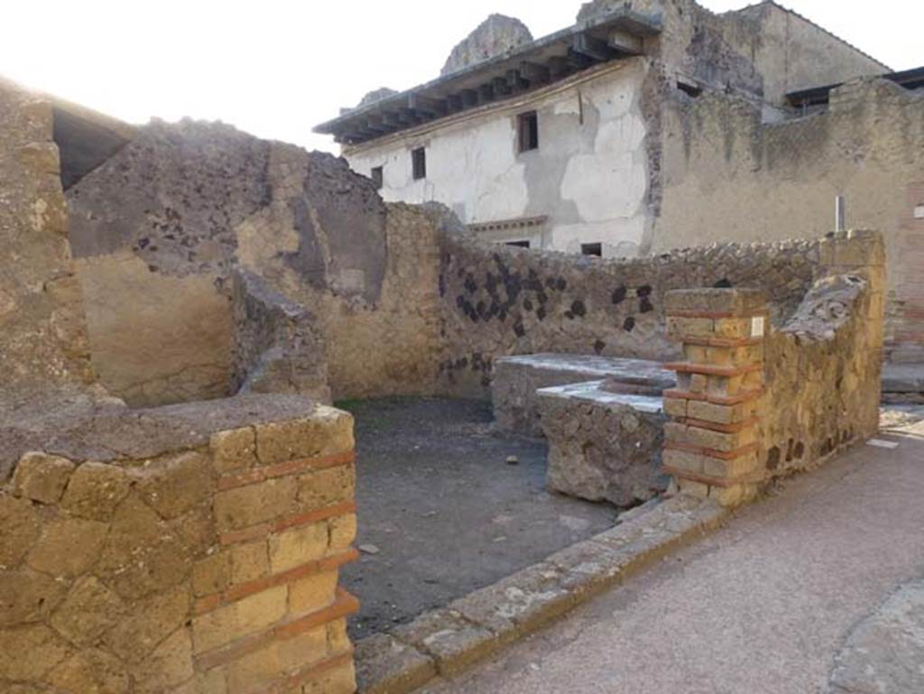 IV.10, Herculaneum, October 2012. Entrance doorway on south side of Decumanus Inferiore, looking westwards. Photo courtesy of Michael Binns.
