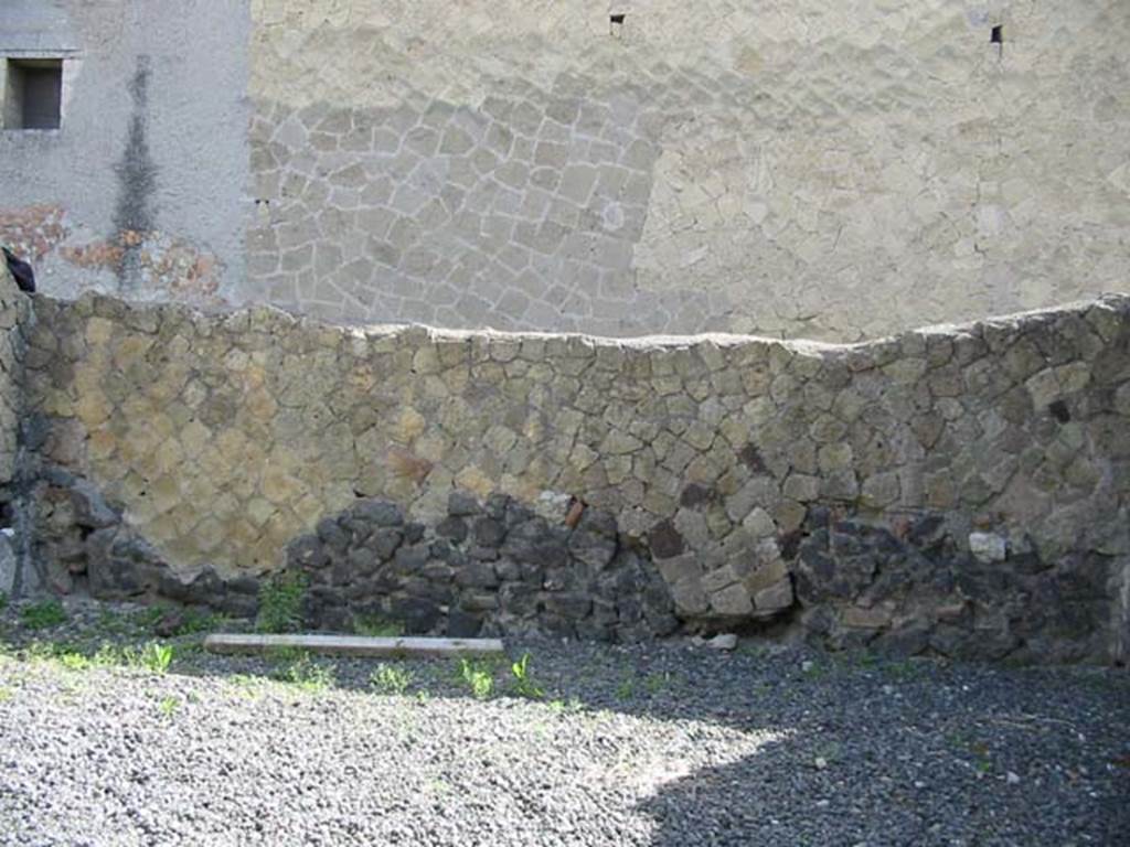 IV.10, Herculaneum, May 2003. Detail of north wall in large room on east side of shoproom. 
Photo courtesy of Nicolas Monteix.
