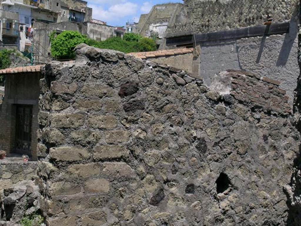 IV.10/11, Herculaneum, May 2005. Looking towards upper west wall on north side of doorway/window. 
Photo courtesy of Nicolas Monteix.
