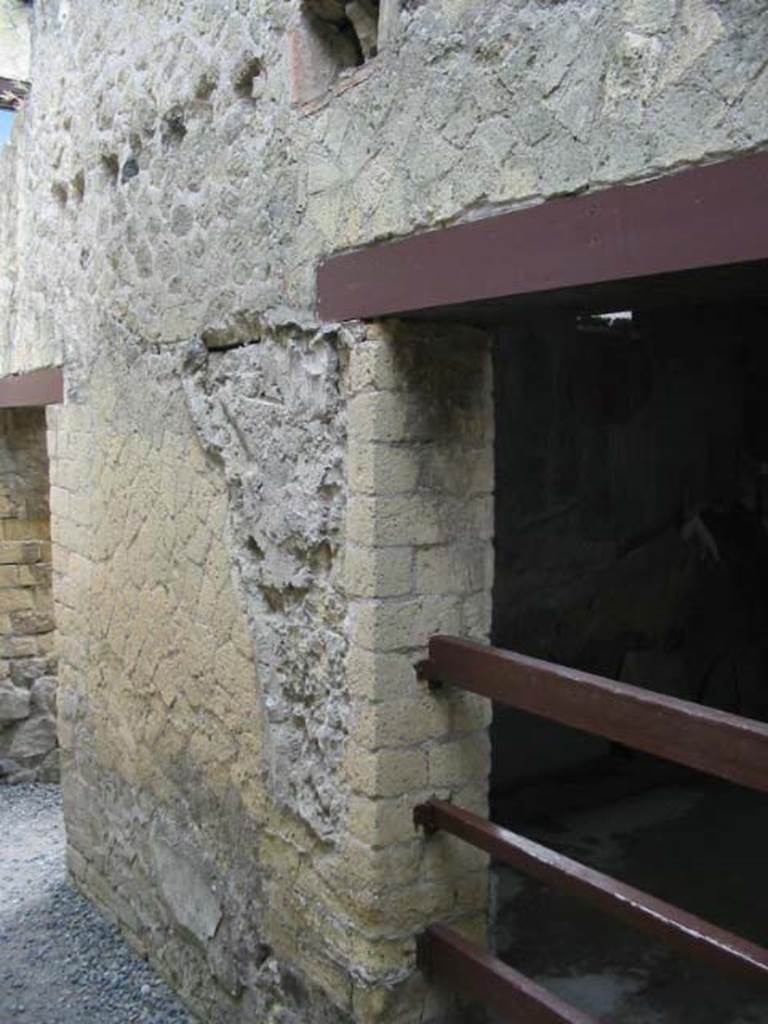 IV.11, Herculaneum, May 2003. 
Looking north-east towards doorway to large triclinium/oecus, on right, and corridor, on left.
Photo courtesy of Nicolas Monteix.
