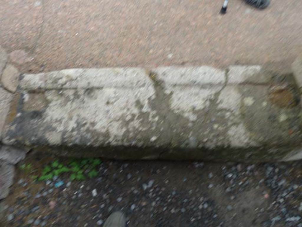 Ins. IV.11, Herculaneum, September 2015. Threshold of doorway, from inside, looking onto pavement of Decumanus Inferiore, looking north.