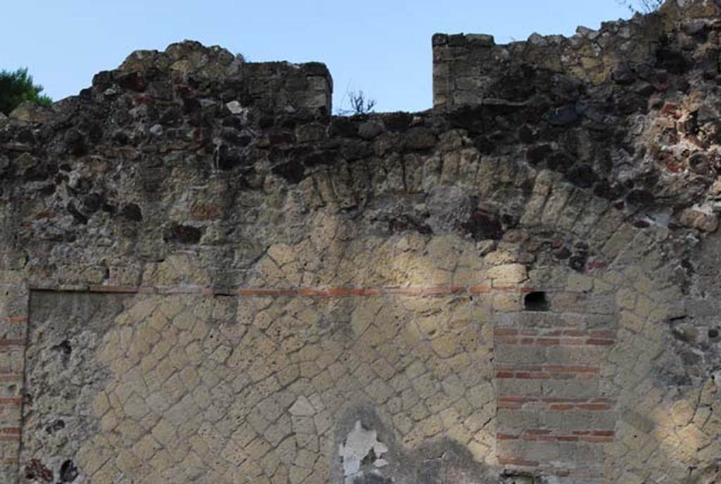 IV.14/15, Herculaneum. June 2008. Detail of exterior upper faade, on south side of Decumanus Inferiore. 
Photo courtesy of Nicolas Monteix. 
