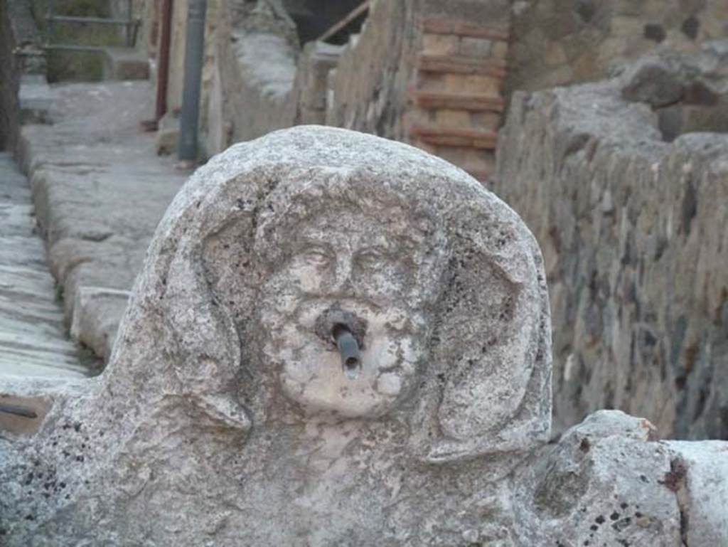 Cardo V Inferiore, Herculaneum, September 2015. Looking south towards fountain decorated with head of Neptune, on corner near Ins. IV 16 on right.